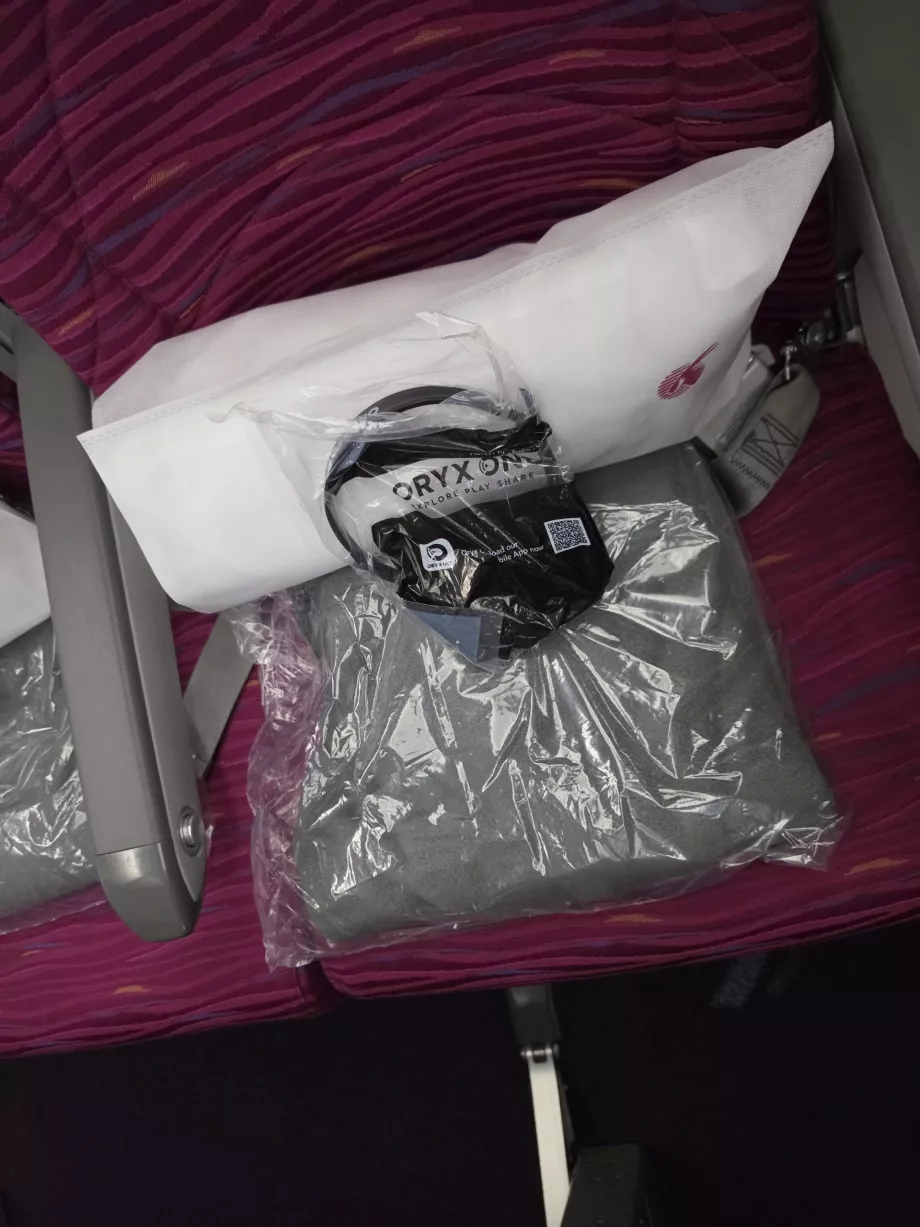 Una almohada, una manta y unos auriculares